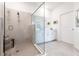 Modern bathroom with a walk-in shower and white cabinets at 14138 Poppy Field Loop # 4122, Punta Gorda, FL 33955