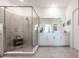 Spa-like bathroom with a large walk-in shower and double vanity at 14138 Poppy Field Loop # 4122, Punta Gorda, FL 33955