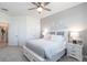 Bright bedroom with a queen bed and built-in storage at 14138 Poppy Field Loop # 4122, Punta Gorda, FL 33955
