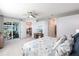 Main bedroom with a king bed, access to balcony and partial kitchen view at 14138 Poppy Field Loop # 4122, Punta Gorda, FL 33955