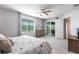 Comfortable bedroom with a king-size bed and private balcony access at 14138 Poppy Field Loop # 4122, Punta Gorda, FL 33955