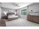 Spacious bedroom with a king-size bed and access to a private balcony at 14138 Poppy Field Loop # 4122, Punta Gorda, FL 33955