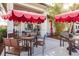 Community cafe with outdoor seating and red umbrellas at 14138 Poppy Field Loop # 4122, Punta Gorda, FL 33955