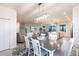 Bright dining room with gray table and white chairs at 14138 Poppy Field Loop # 4122, Punta Gorda, FL 33955