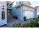 Townhome entry with paver driveway and a bench at 14138 Poppy Field Loop # 4122, Punta Gorda, FL 33955