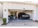 Two-car garage with epoxy floor, boat, and SUV at 14138 Poppy Field Loop # 4122, Punta Gorda, FL 33955