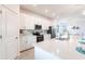Modern kitchen with white cabinets and stainless steel appliances at 14138 Poppy Field Loop # 4122, Punta Gorda, FL 33955