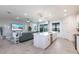 Open concept living room with kitchen and balcony view at 14138 Poppy Field Loop # 4122, Punta Gorda, FL 33955