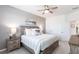 Spacious main bedroom with king-size bed, nightstands and ceiling fan at 14138 Poppy Field Loop # 4122, Punta Gorda, FL 33955