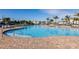 Large resort-style pool with plenty of lounge chairs at 14138 Poppy Field Loop # 4122, Punta Gorda, FL 33955