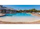 Resort-style pool with a sandy bottom and plenty of lounge chairs at 14138 Poppy Field Loop # 4122, Punta Gorda, FL 33955