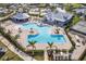 Aerial view of resort-style pool and clubhouse at 14138 Poppy Field Loop # 4122, Punta Gorda, FL 33955