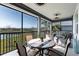 Spacious screened lanai with lake view and comfortable seating at 14138 Poppy Field Loop # 4122, Punta Gorda, FL 33955