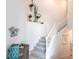 Modern staircase with coastal decor and wall art at 14138 Poppy Field Loop # 4122, Punta Gorda, FL 33955