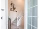 Bright entryway with staircase and coastal decor at 14138 Poppy Field Loop # 4122, Punta Gorda, FL 33955