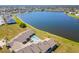 Aerial view showcasing lakefront property and pool at 1415 San Cristobal Ave # A4, Punta Gorda, FL 33983