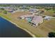 Aerial view of lakefront homes and community pool at 1415 San Cristobal Ave # A4, Punta Gorda, FL 33983