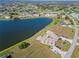Aerial view showing lakefront community and golf course at 1415 San Cristobal Ave # A4, Punta Gorda, FL 33983