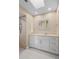 Updated bathroom featuring a walk-in shower and skylight at 1415 San Cristobal Ave # A4, Punta Gorda, FL 33983