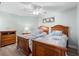 Guest bedroom with twin beds and wooden furniture at 1415 San Cristobal Ave # A4, Punta Gorda, FL 33983