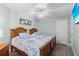 Two twin beds, ceiling fan, and light wood flooring at 1415 San Cristobal Ave # A4, Punta Gorda, FL 33983