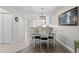 Bright dining area with table and chairs, adjacent to kitchen at 1415 San Cristobal Ave # A4, Punta Gorda, FL 33983