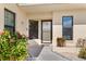 Condo entryway with door and lush landscaping at 1415 San Cristobal Ave # A4, Punta Gorda, FL 33983