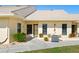 Exterior view of condo, featuring a walkway and landscaping at 1415 San Cristobal Ave # A4, Punta Gorda, FL 33983