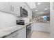 Updated kitchen featuring granite countertops and stainless steel appliances at 1415 San Cristobal Ave # A4, Punta Gorda, FL 33983