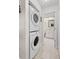 Stackable washer and dryer in a small laundry room at 1415 San Cristobal Ave # A4, Punta Gorda, FL 33983