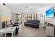 Relaxing living room with comfortable seating and sliding glass doors to backyard at 1415 San Cristobal Ave # A4, Punta Gorda, FL 33983
