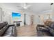 Spacious living room featuring leather couches and a large TV at 1415 San Cristobal Ave # A4, Punta Gorda, FL 33983