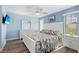 Main bedroom with king-size bed and light blue walls at 1415 San Cristobal Ave # A4, Punta Gorda, FL 33983