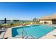 Community pool with lounge chairs and waterfront view at 1415 San Cristobal Ave # A4, Punta Gorda, FL 33983