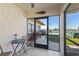Small screened porch overlooking the canal and pool at 1415 San Cristobal Ave # A4, Punta Gorda, FL 33983