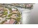 Aerial view of a waterfront home with private pool and dock at 1435 Sea Fan Dr, Punta Gorda, FL 33950