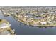 Aerial view of luxurious waterfront homes and canals at 1435 Sea Fan Dr, Punta Gorda, FL 33950