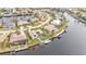 Aerial view of a canal-front home with private pool and dock at 1435 Sea Fan Dr, Punta Gorda, FL 33950