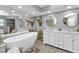 Large bathroom with double vanity, soaking tub and walk-in shower at 1435 Sea Fan Dr, Punta Gorda, FL 33950