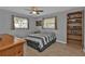 Bedroom with striped bedding and built-in shelving at 1435 Sea Fan Dr, Punta Gorda, FL 33950