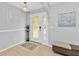 Bright entryway with tiled floors, featuring a modern door and decorative accents at 1435 Sea Fan Dr, Punta Gorda, FL 33950