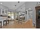 Kitchen with breakfast nook, white cabinets, and view of the pool and patio at 1435 Sea Fan Dr, Punta Gorda, FL 33950