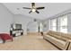 Open living room and adjacent dining area with vaulted ceilings and tiled floors at 1435 Sea Fan Dr, Punta Gorda, FL 33950