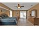 Bright main bedroom with a king-size bed and access to the patio and pool at 1435 Sea Fan Dr, Punta Gorda, FL 33950