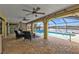 Relaxing pool area with patio furniture and canal views at 1435 Sea Fan Dr, Punta Gorda, FL 33950