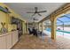Covered patio with pool access and canal views at 1435 Sea Fan Dr, Punta Gorda, FL 33950