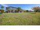 Large backyard with screened pool and lush landscaping at 1717 Nuremberg Blvd, Punta Gorda, FL 33983