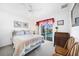 Bedroom with pool view, offering a relaxing atmosphere at 1717 Nuremberg Blvd, Punta Gorda, FL 33983