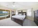 Bright bedroom with pool view and king-size bed at 1717 Nuremberg Blvd, Punta Gorda, FL 33983