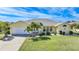 Single story home with two car garage and manicured lawn at 1717 Nuremberg Blvd, Punta Gorda, FL 33983